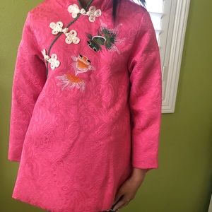 Pink dress with multiple layers inside.